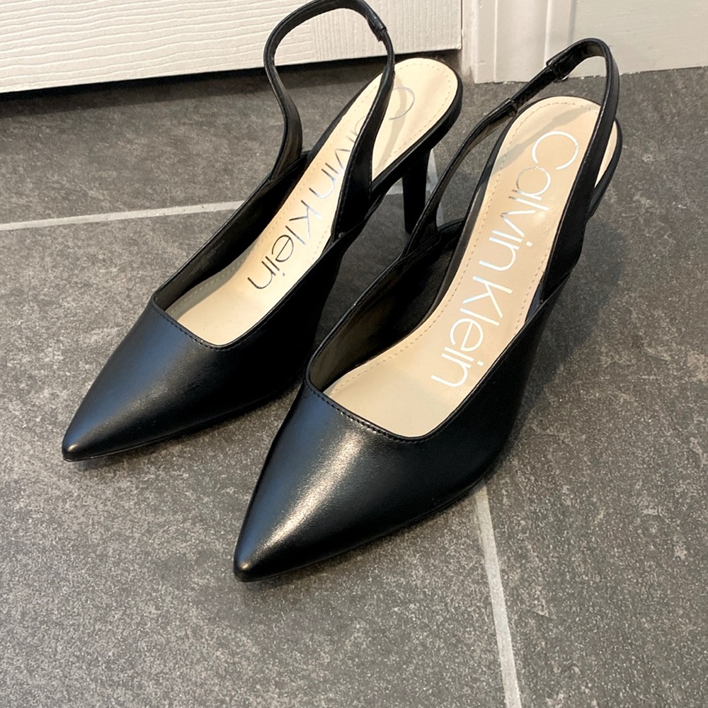 Calvin Kline black sling back pumps.